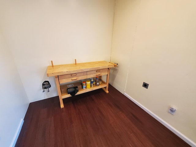 washroom with hookup for an electric dryer and dark hardwood / wood-style flooring