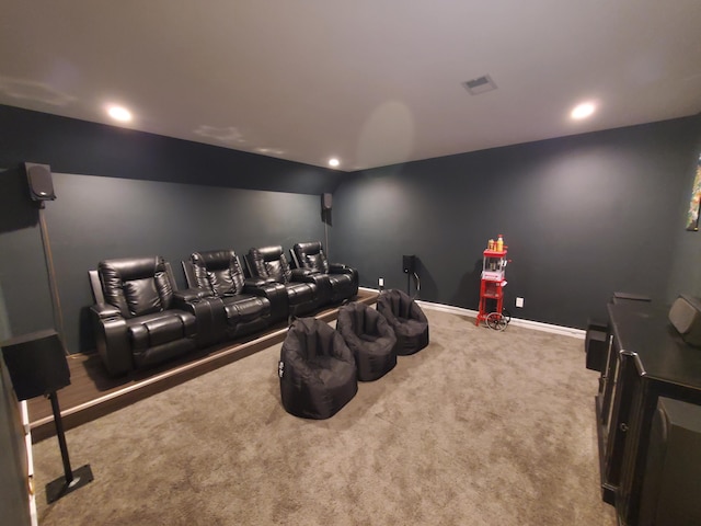 cinema featuring carpet floors and vaulted ceiling