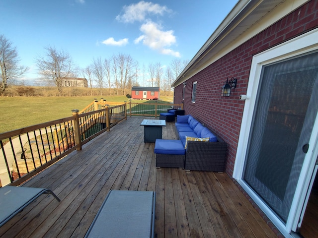 deck with an outdoor living space and a lawn