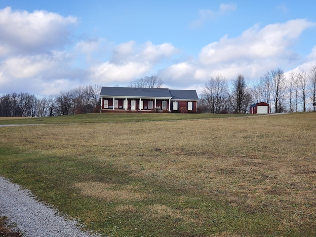 view of front facade with a porch, a garage, and a front lawn