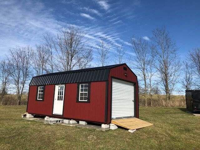 view of outbuilding featuring a lawn