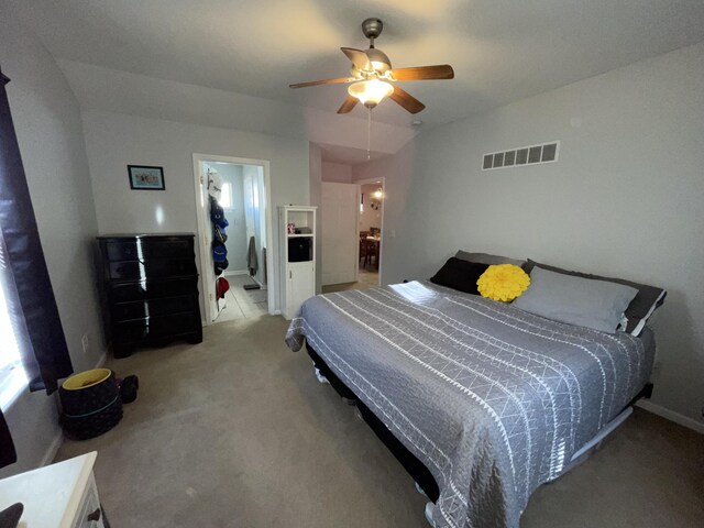 bedroom featuring multiple windows and ceiling fan