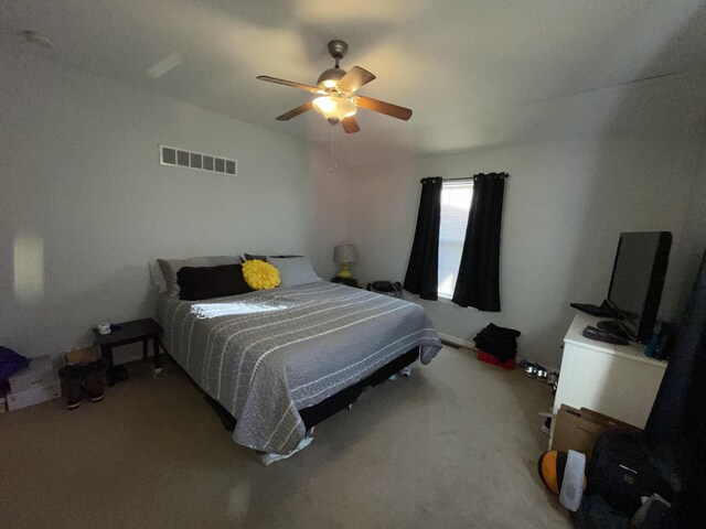 bedroom featuring visible vents, ceiling fan, and carpet flooring