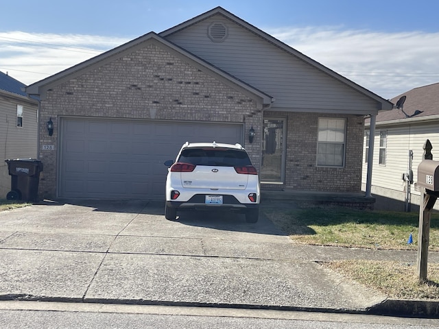 view of front of house with concrete driveway, brick siding, and an attached garage