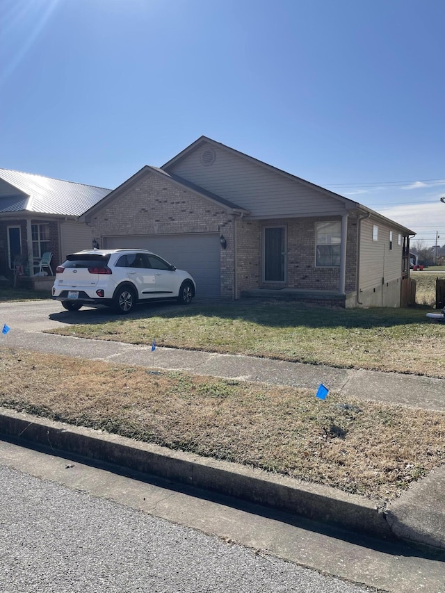 ranch-style house with a front lawn, concrete driveway, brick siding, and an attached garage