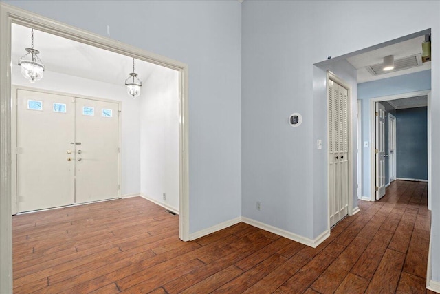 foyer with dark hardwood / wood-style flooring