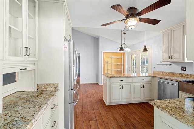 kitchen featuring white cabinetry, dark hardwood / wood-style flooring, hanging light fixtures, stainless steel appliances, and light stone countertops