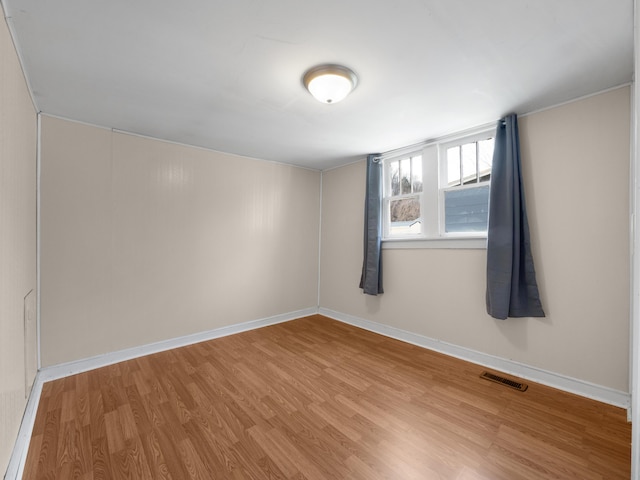 spare room featuring light hardwood / wood-style floors