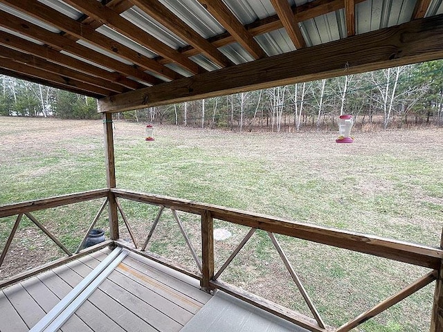 wooden deck with a lawn