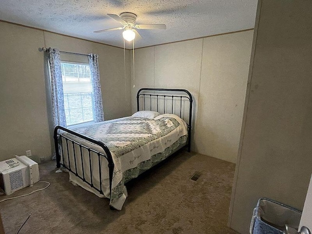 bedroom with dark carpet, a wall unit AC, a textured ceiling, and ceiling fan