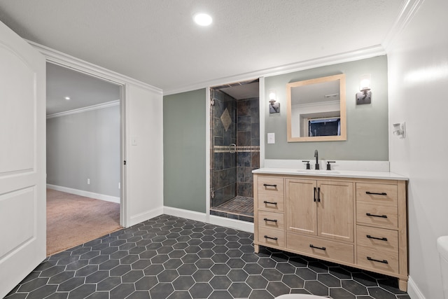 bathroom featuring crown molding, vanity, and a tile shower