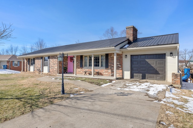 ranch-style house with a garage, a porch, and a front lawn