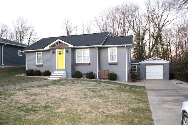 view of front of house featuring a shingled roof, a front lawn, concrete driveway, and an outdoor structure