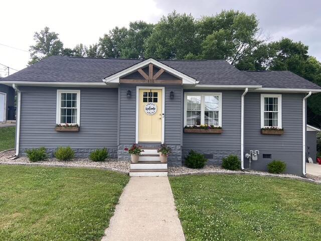 view of front of home featuring crawl space, entry steps, a front lawn, and roof with shingles