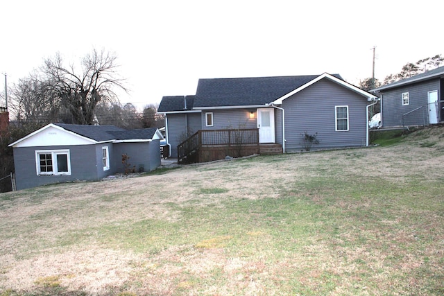 rear view of house with a yard