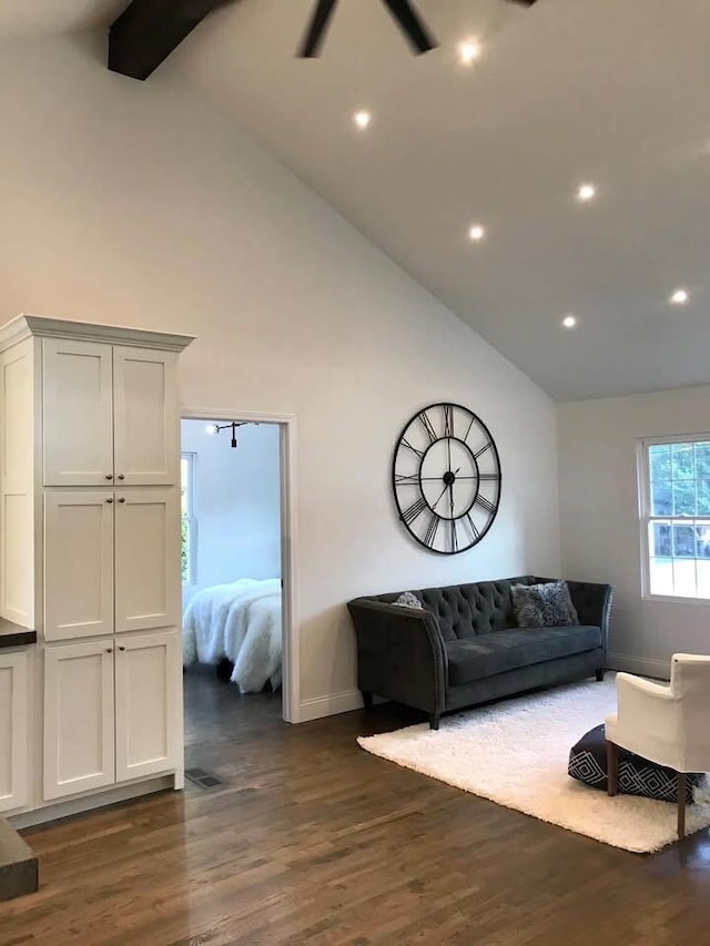 living area featuring dark wood-style floors, baseboards, high vaulted ceiling, and recessed lighting