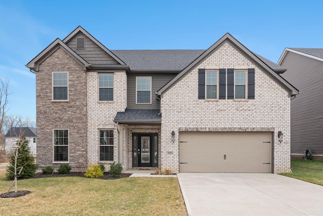 view of front of home featuring a garage and a front yard