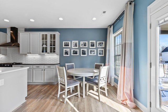 dining area with light hardwood / wood-style flooring