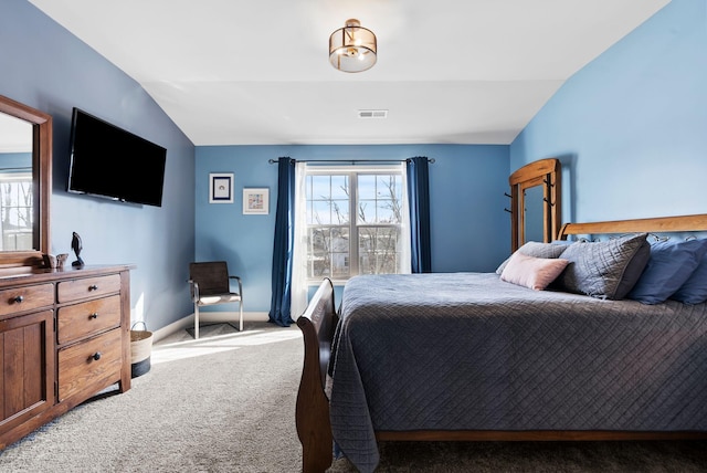 carpeted bedroom featuring vaulted ceiling