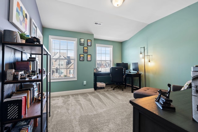 office area featuring lofted ceiling and carpet flooring