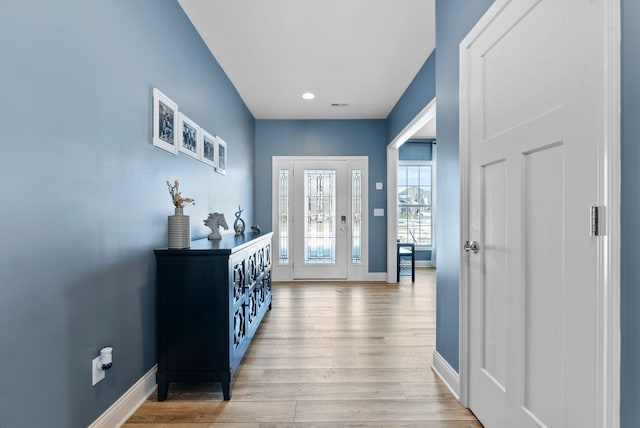 foyer with light hardwood / wood-style floors