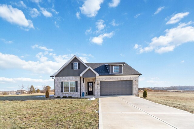 view of front of property with a garage and a front yard