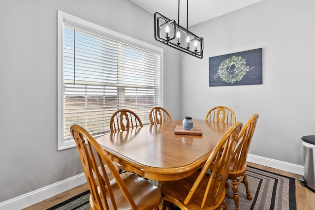 288 Liam Way, Paint Lick, KY 40461 - dining area featuring baseboards, a chandelier, and wood finished floors