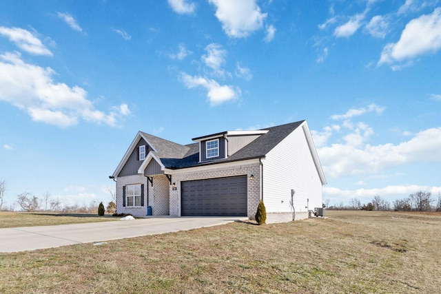 288 Liam Way, Paint Lick, KY 40461 - view of front of house featuring central AC unit, brick siding, an attached garage, concrete driveway, and a front lawn