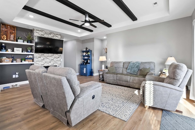 288 Liam Way, Paint Lick, KY 40461 - living area with visible vents, recessed lighting, a fireplace, ceiling fan, and a tray ceiling
