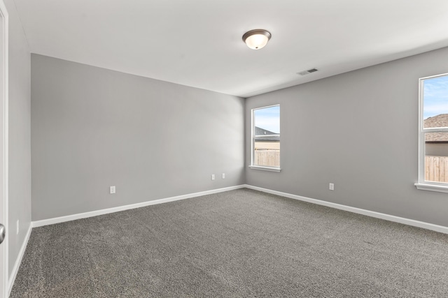 unfurnished room featuring carpet floors