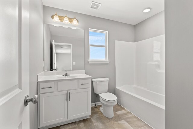 full bathroom with vanity, bathtub / shower combination, and toilet