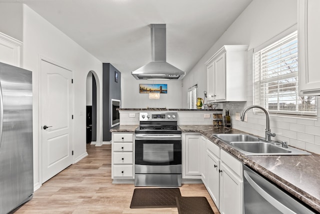 kitchen with white cabinetry, appliances with stainless steel finishes, sink, and exhaust hood