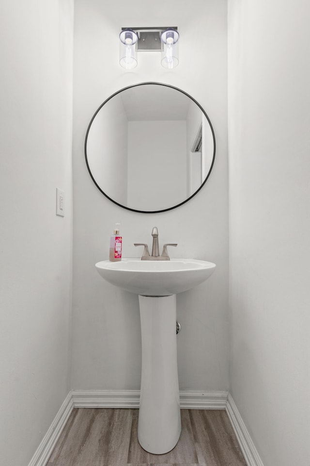 bathroom featuring hardwood / wood-style flooring and sink