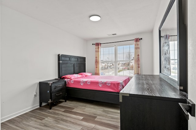 bedroom featuring light hardwood / wood-style flooring