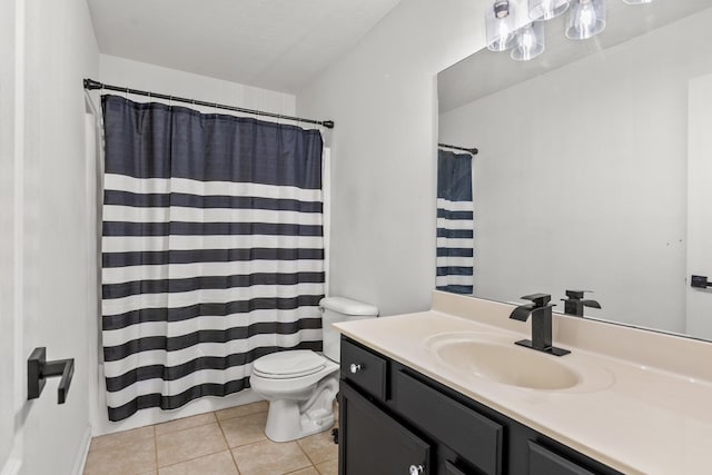 bathroom with vanity, tile patterned floors, and toilet