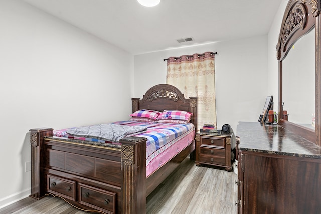 bedroom with light wood-type flooring