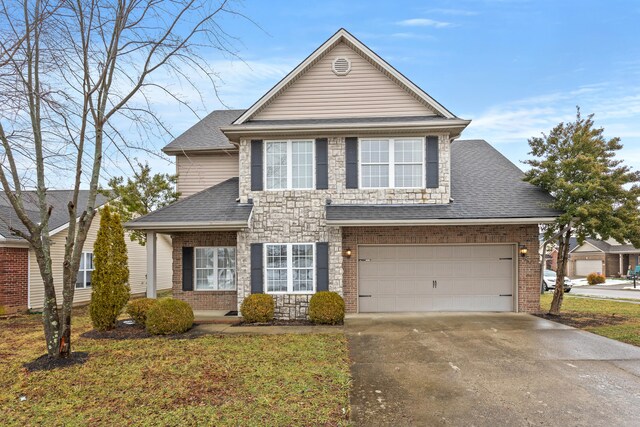 view of front property with a garage and a front lawn