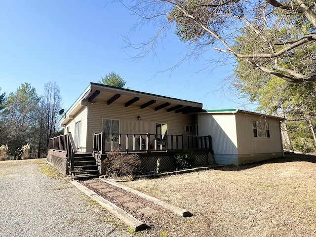 view of front of house featuring a wooden deck