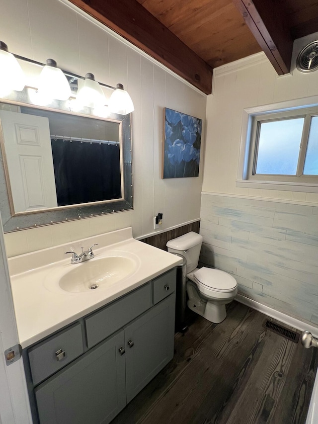 bathroom featuring toilet, wooden ceiling, hardwood / wood-style flooring, vanity, and beamed ceiling