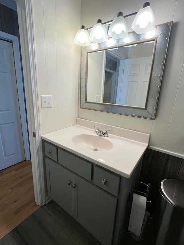 bathroom featuring vanity and hardwood / wood-style floors