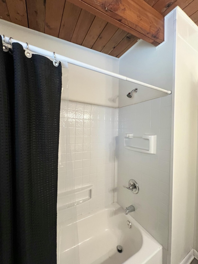 bathroom featuring beamed ceiling, shower / tub combo, and wood ceiling