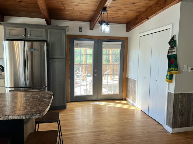 doorway to outside featuring beam ceiling, wooden ceiling, french doors, and light wood-type flooring