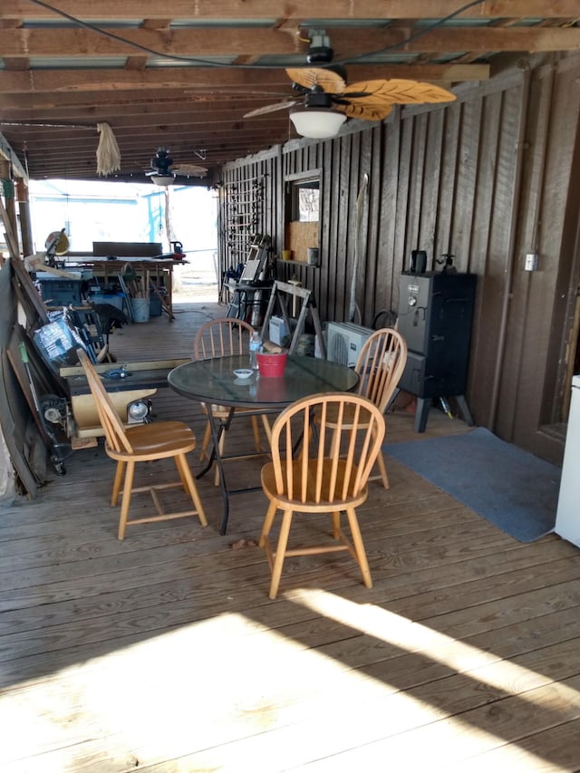 dining room with hardwood / wood-style floors and ceiling fan