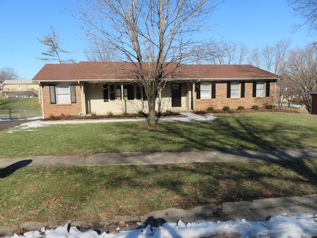 ranch-style home with a front lawn