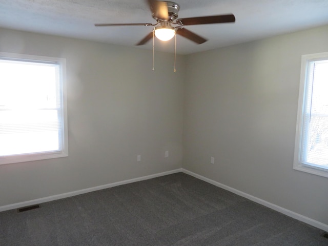 carpeted empty room with ceiling fan