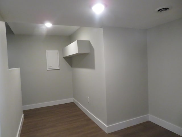 laundry area with dark hardwood / wood-style flooring