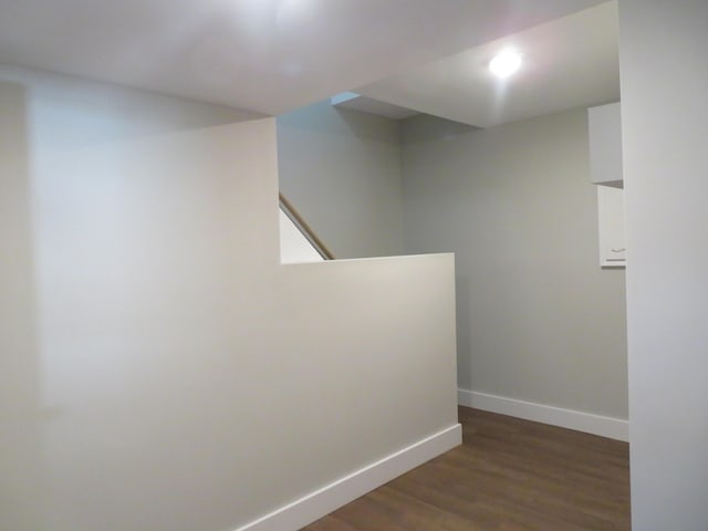 hallway featuring dark hardwood / wood-style floors