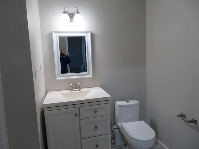 bathroom with vanity and toilet