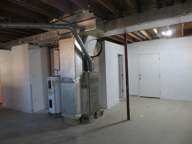 basement featuring heating unit and water heater