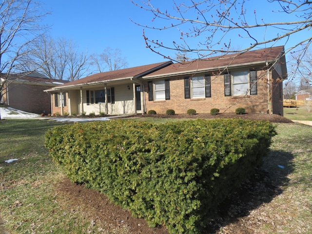 ranch-style home with a front lawn